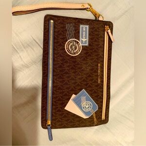 Brand new, limited edition,rare/collective authentic Michael Kors travel pouch.